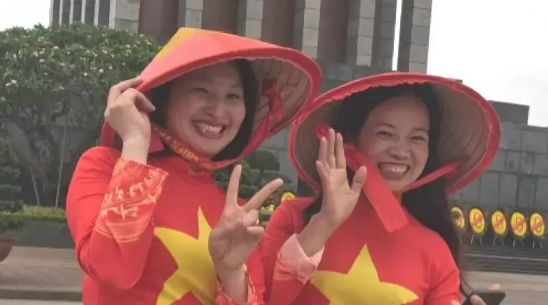 Proud Vietnamese women in front of the Ho Chi Minh Mausoleum